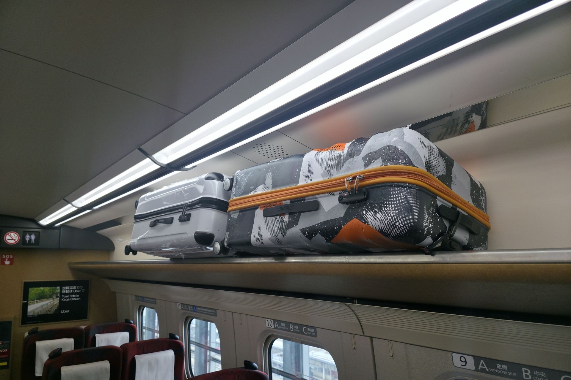 Luggage stored on Shinkansen overhead rack